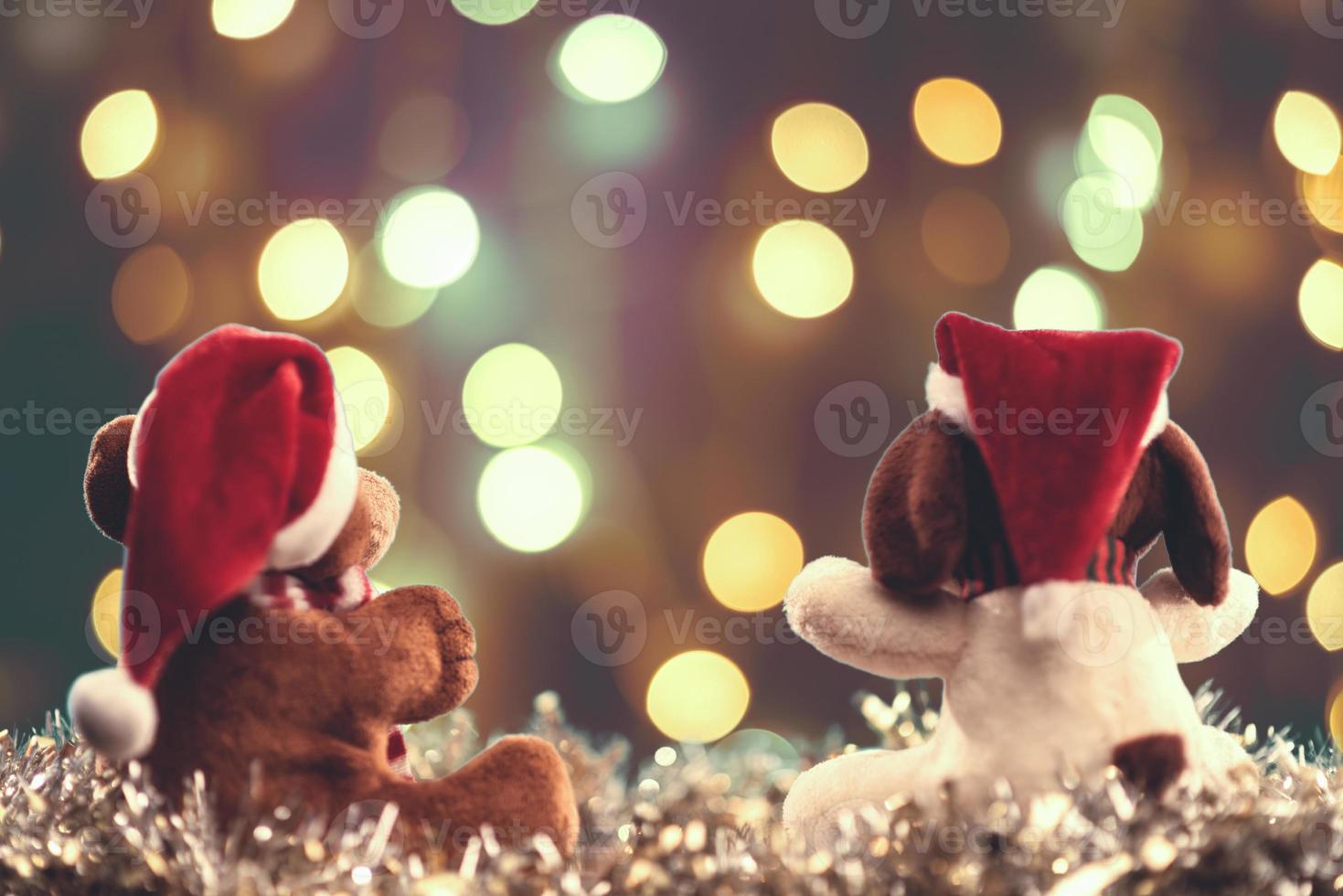 Two teddy bears enjoying Christmas and New Year Eve, New Year celebration concept. photo