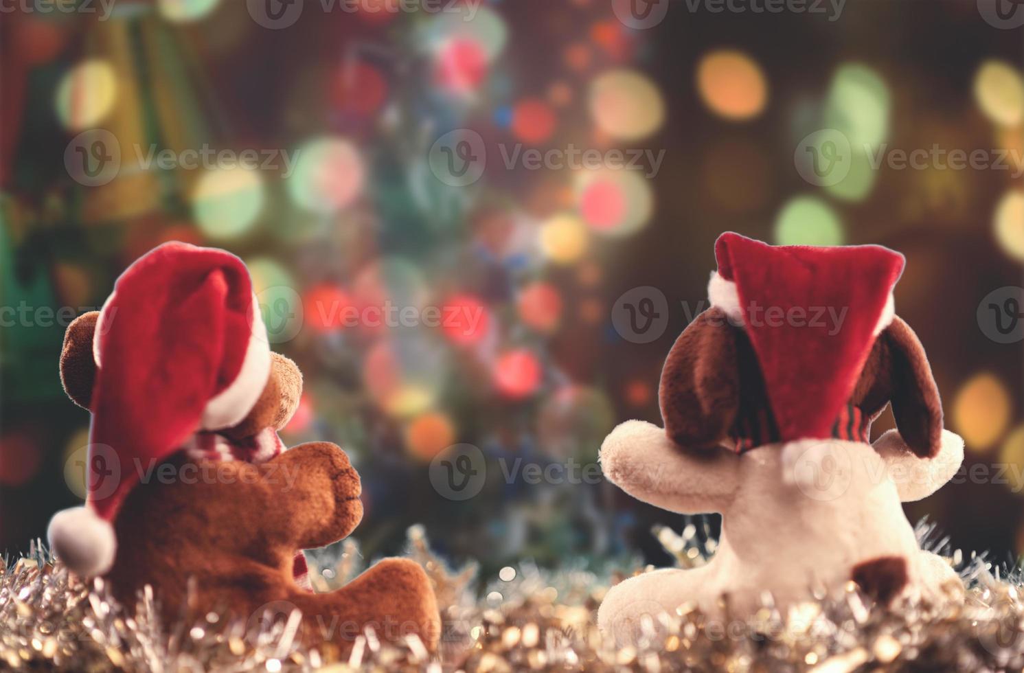 Two teddy bears enjoying Christmas and New Year Eve, New Year celebration concept. photo