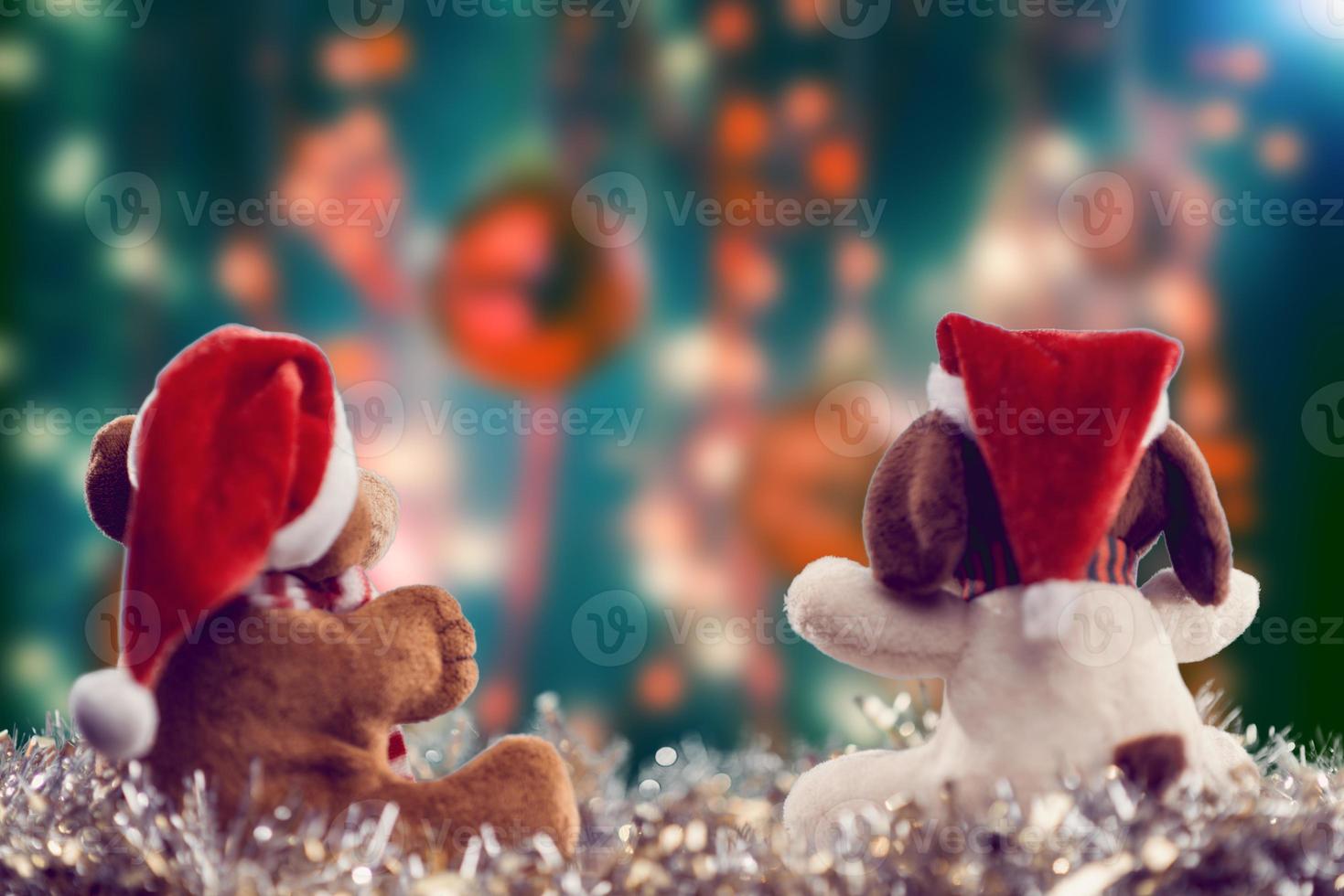 Two teddy bears enjoying Christmas and New Year Eve, New Year celebration concept. photo