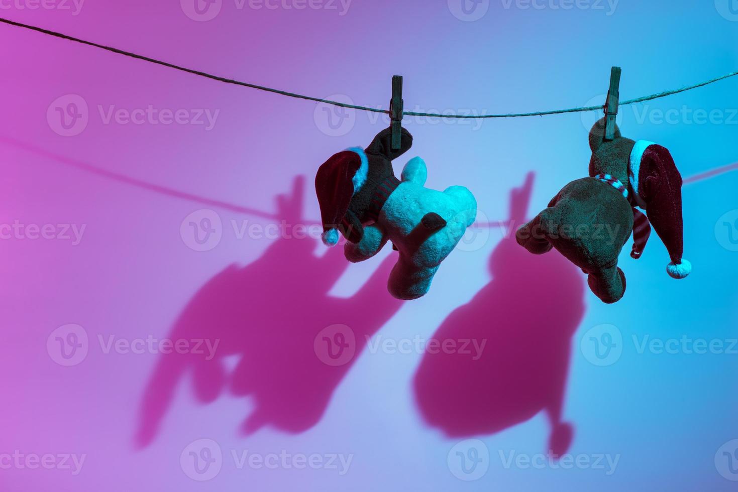 Two teddy bears enjoying Christmas and New Year Eve, New Year celebration concept. photo