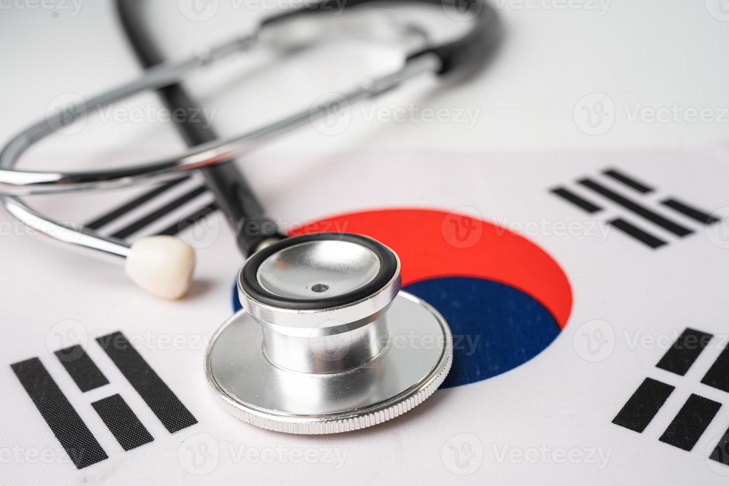 Stethoscope on Korea flag, check problem of business and finance concept. photo