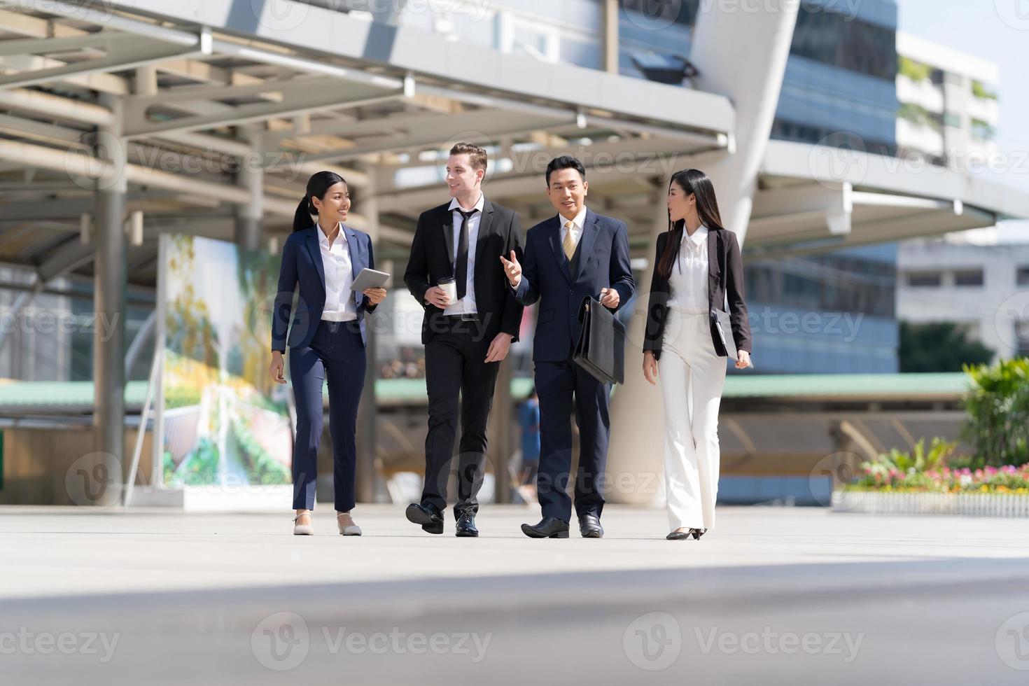 Business people walking and talk to each other photo