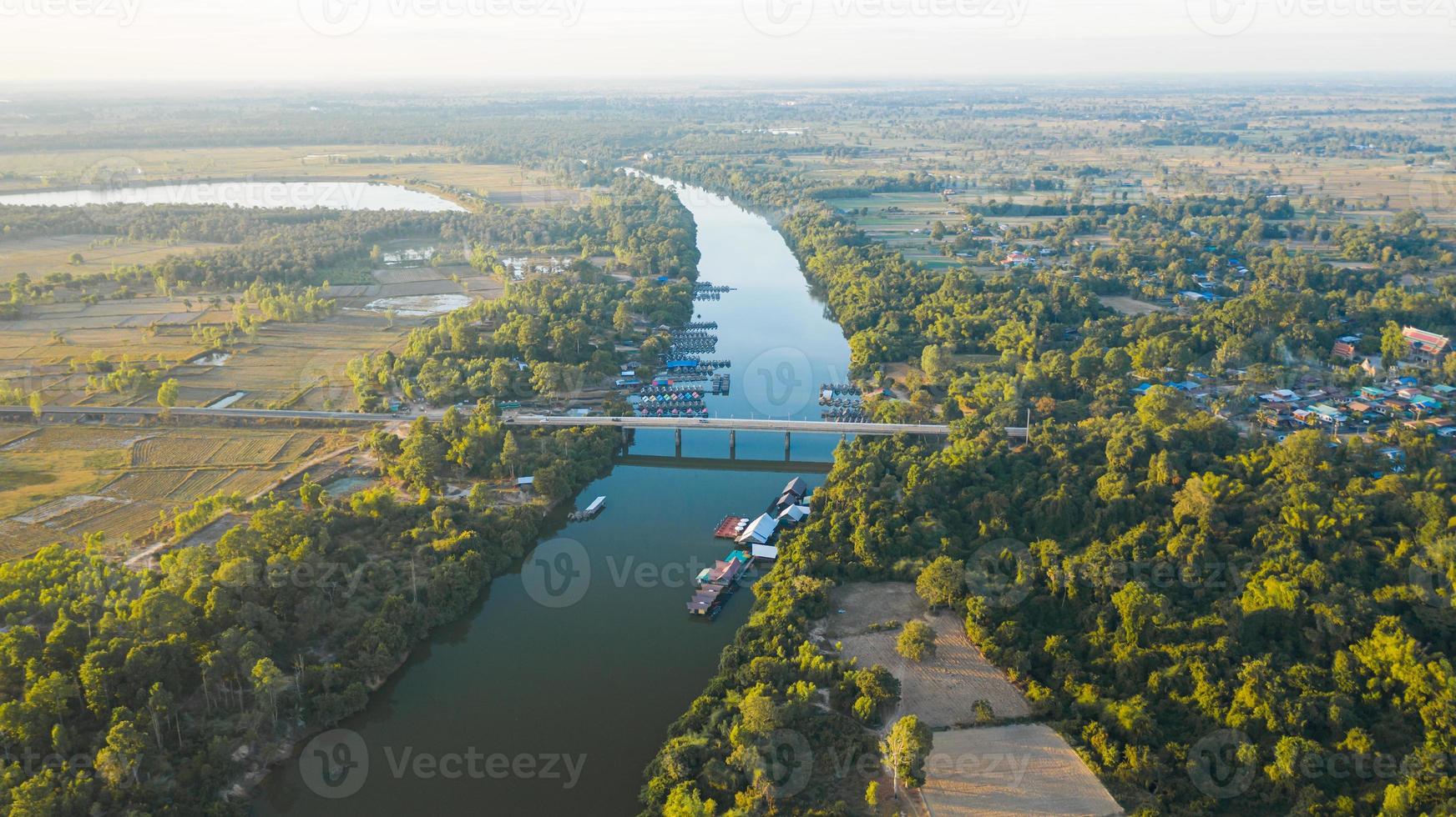 Scenic aerial view of the river bridge in rural Thailand photo