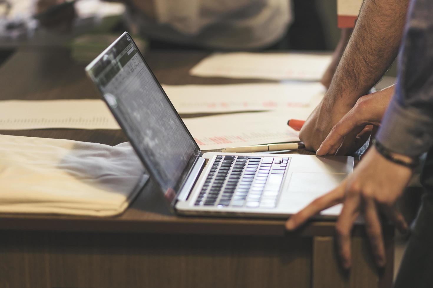 Businessman using laptop at meeting. Success and business concept. photo