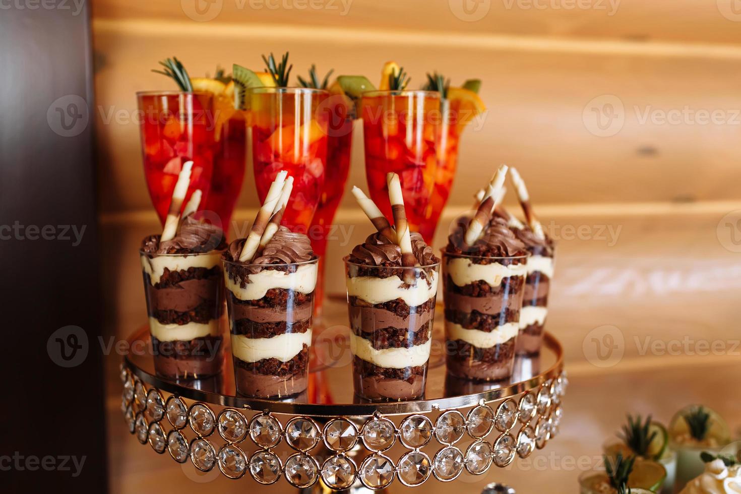 table with colorful sweets and goodies for the wedding party reception, decoration dessert table. Delicious sweets on candy buffet. Dessert table for a party. cakes, cupcakes. selective focus. photo