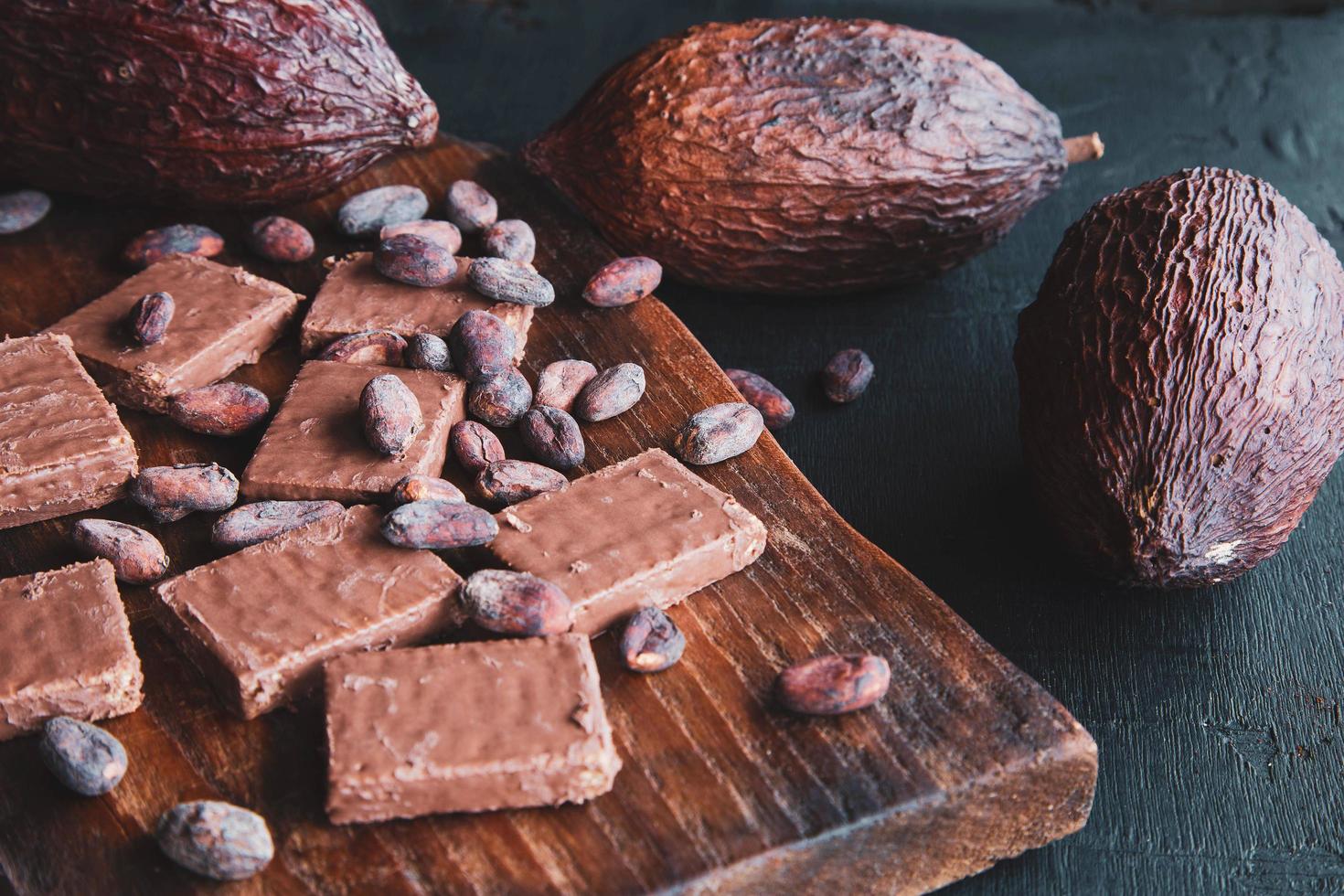 Chocolate and Cocoa Beans with Cocoa On a black background photo