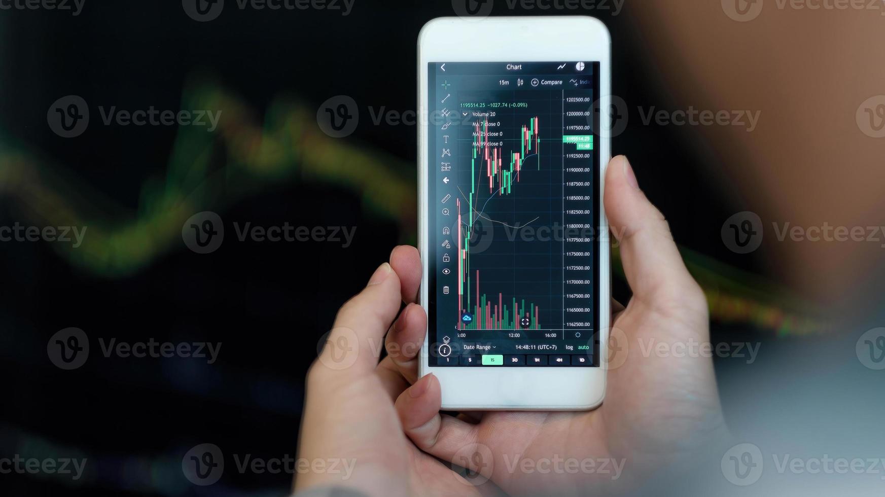 Business man trader investor analyst using mobile phone app analytics for cryptocurrency financial market analysis, trading data index chart graph on smartphone. photo