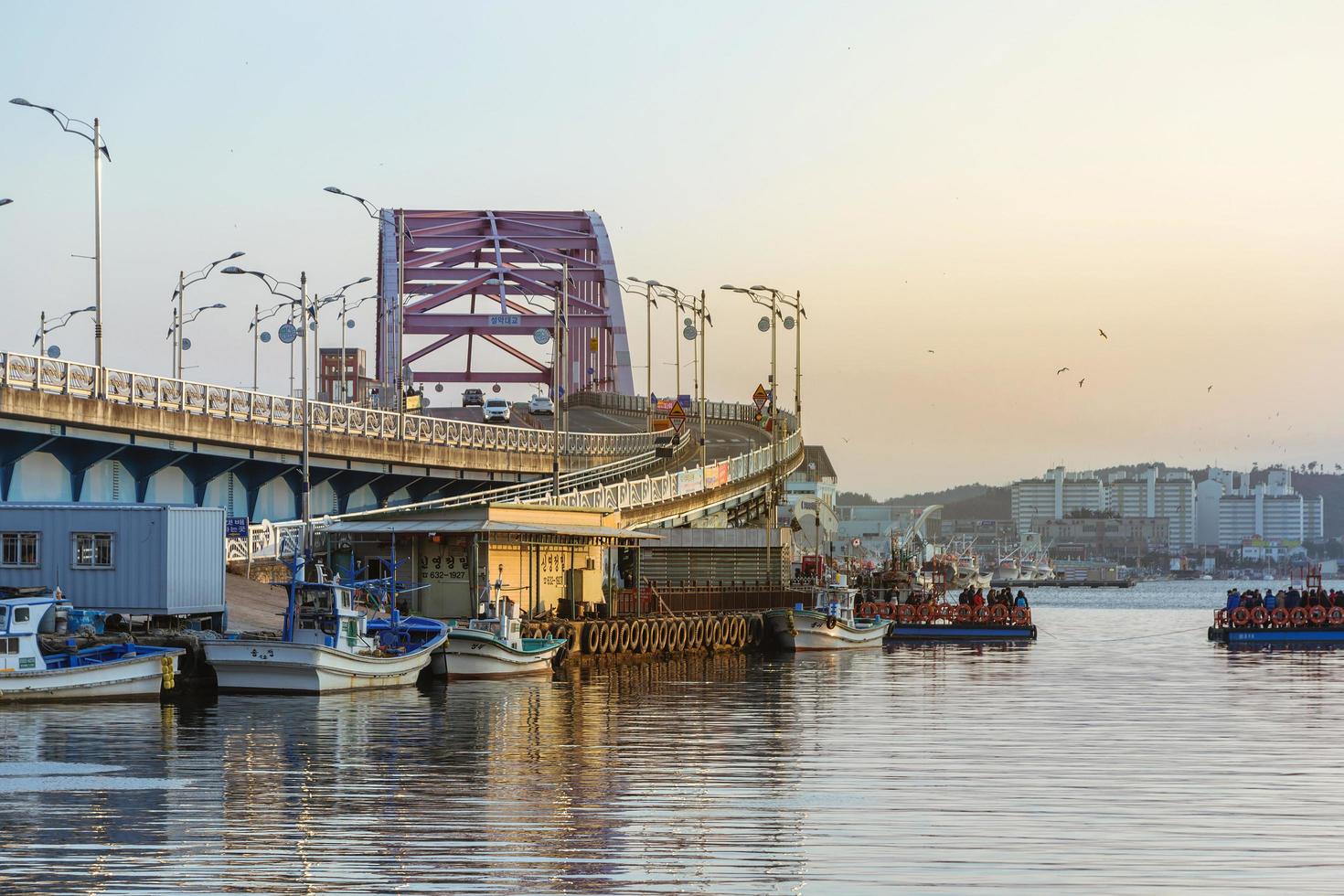 Seoul, Korea, Jan 02, 2016 - Bridge over a river in a fishing village photo