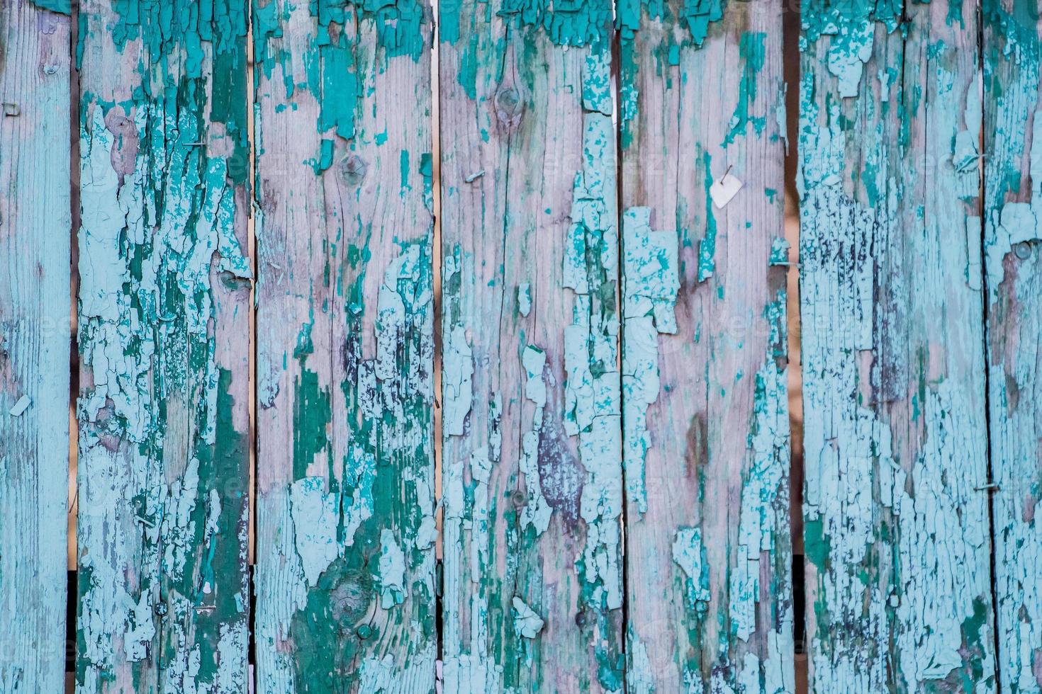 Texture of old cracked paint on wooden boards. photo