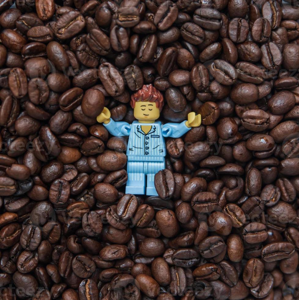 Warsaw 2020 - Lego minifigure sleeping in the coffee seeds photo