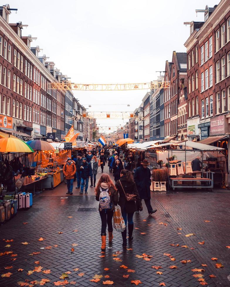 Amsterdam, Netherlands 2018- People walking in a street market in Amsterdam photo