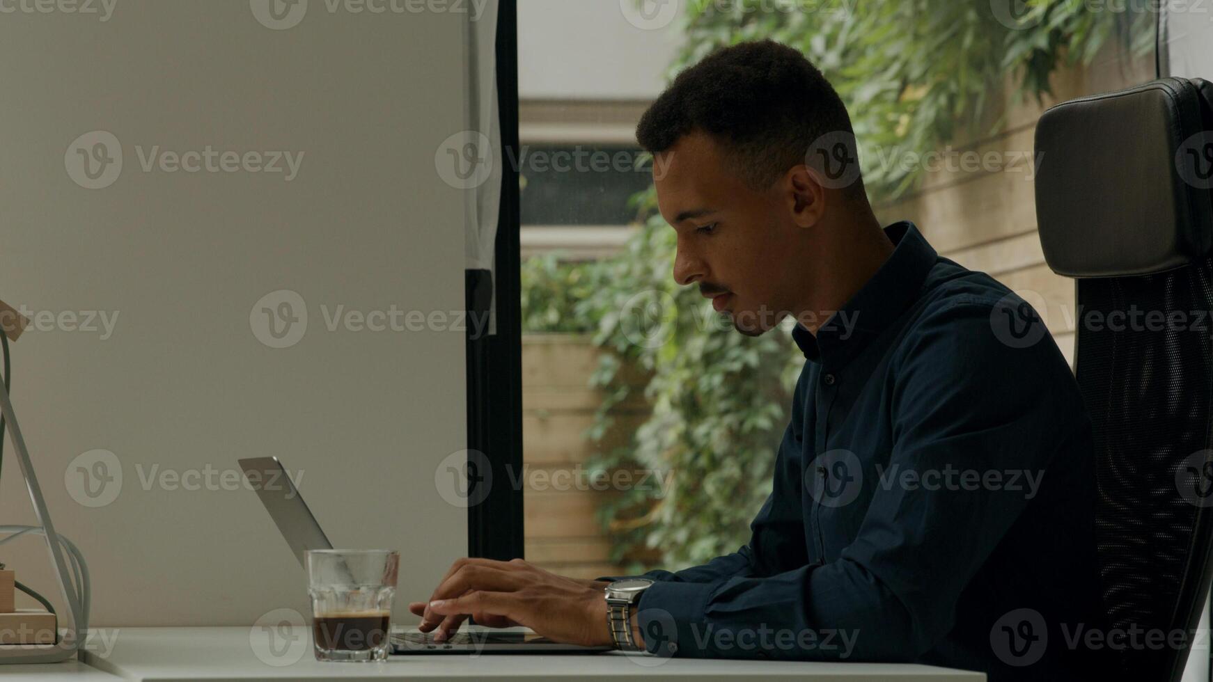 Colleagues working on computers in office photo