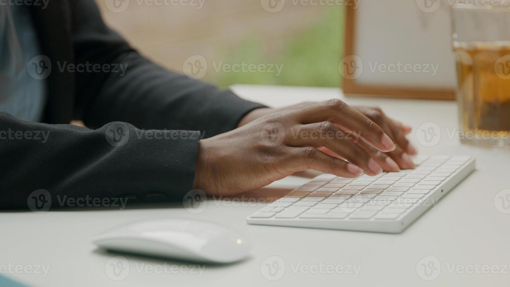 Woman using wireless keyboard and mouse photo