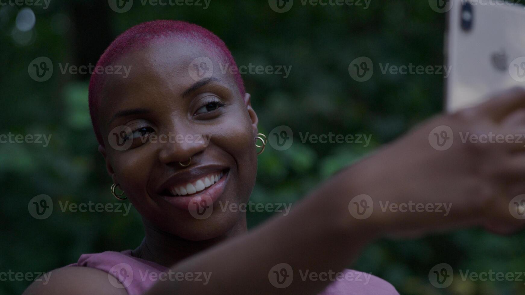 Young woman taking selfie on smartphone photo