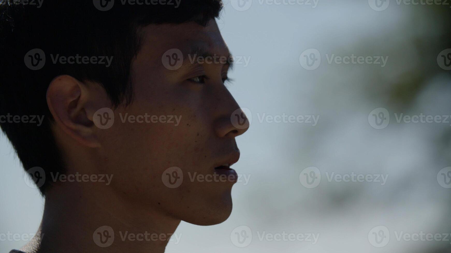 Portrait of mid adult man drinking water after exercise photo