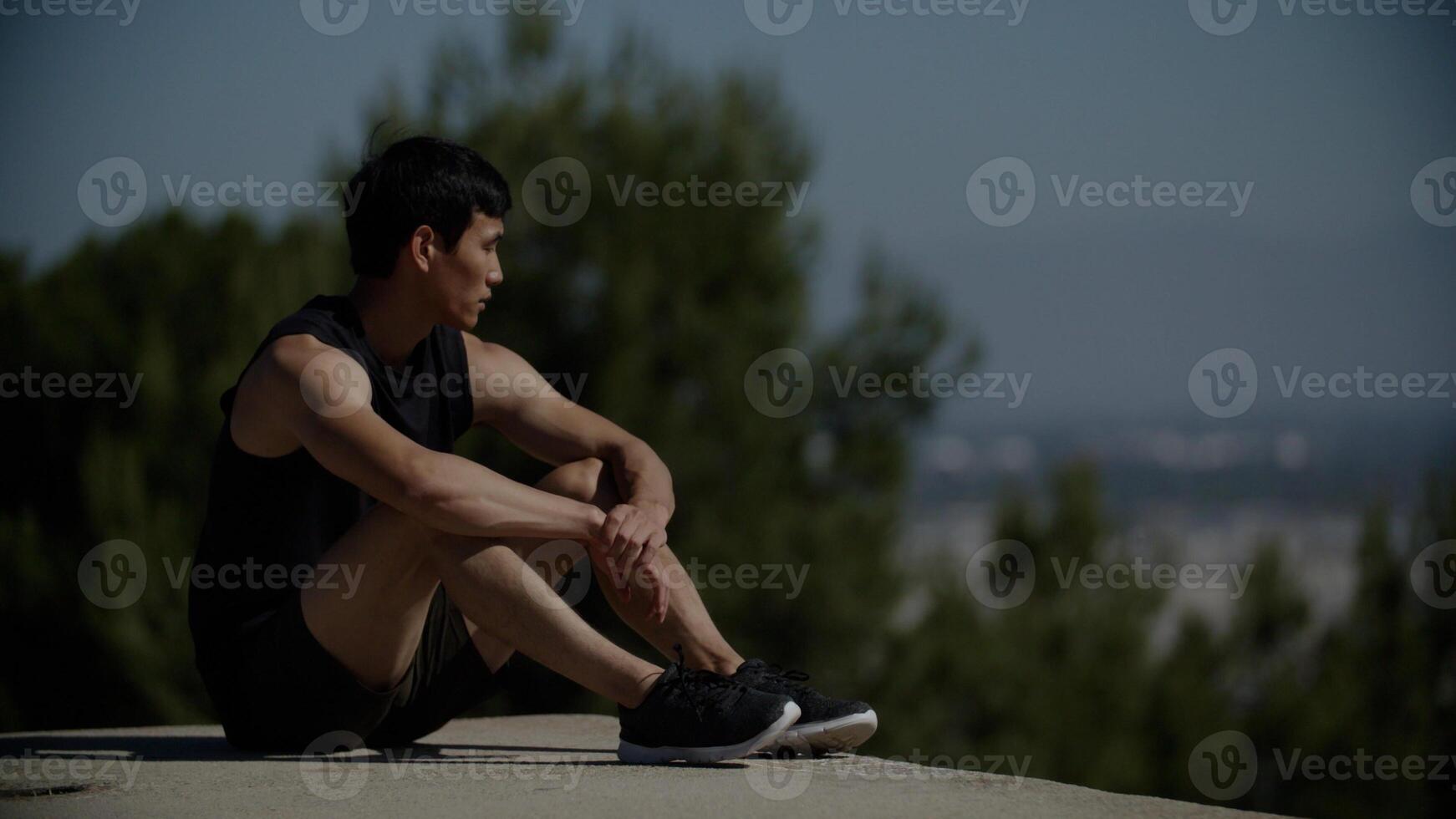 Portrait of mid adult man doing crunches photo