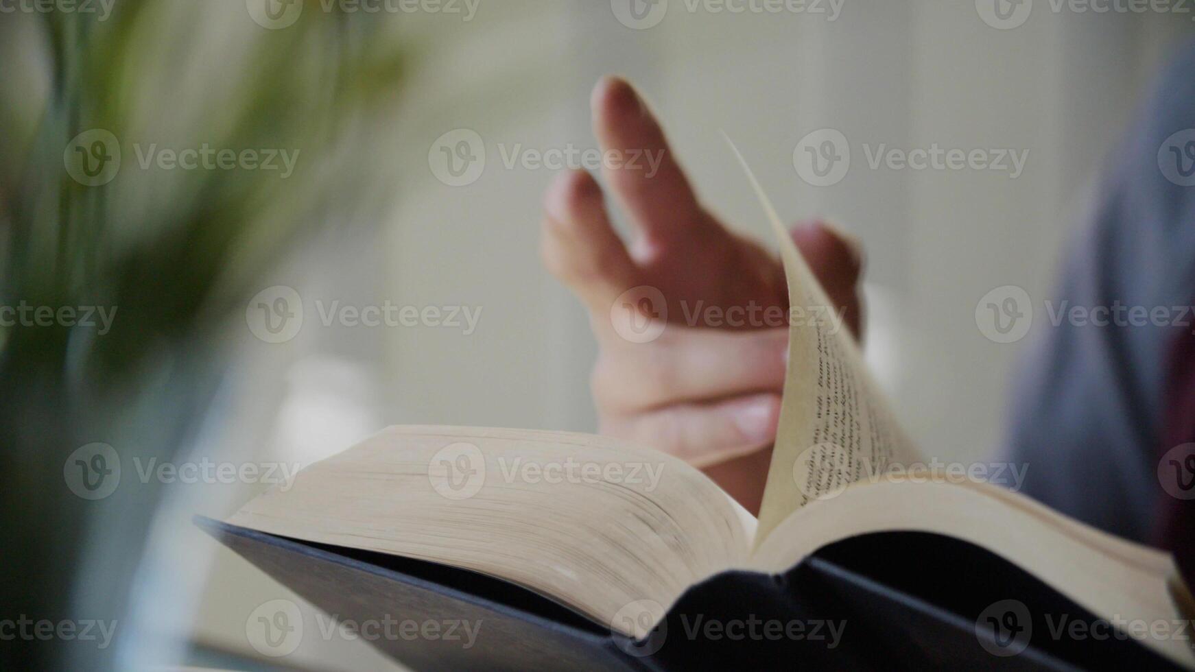 Portrait of man reading book photo