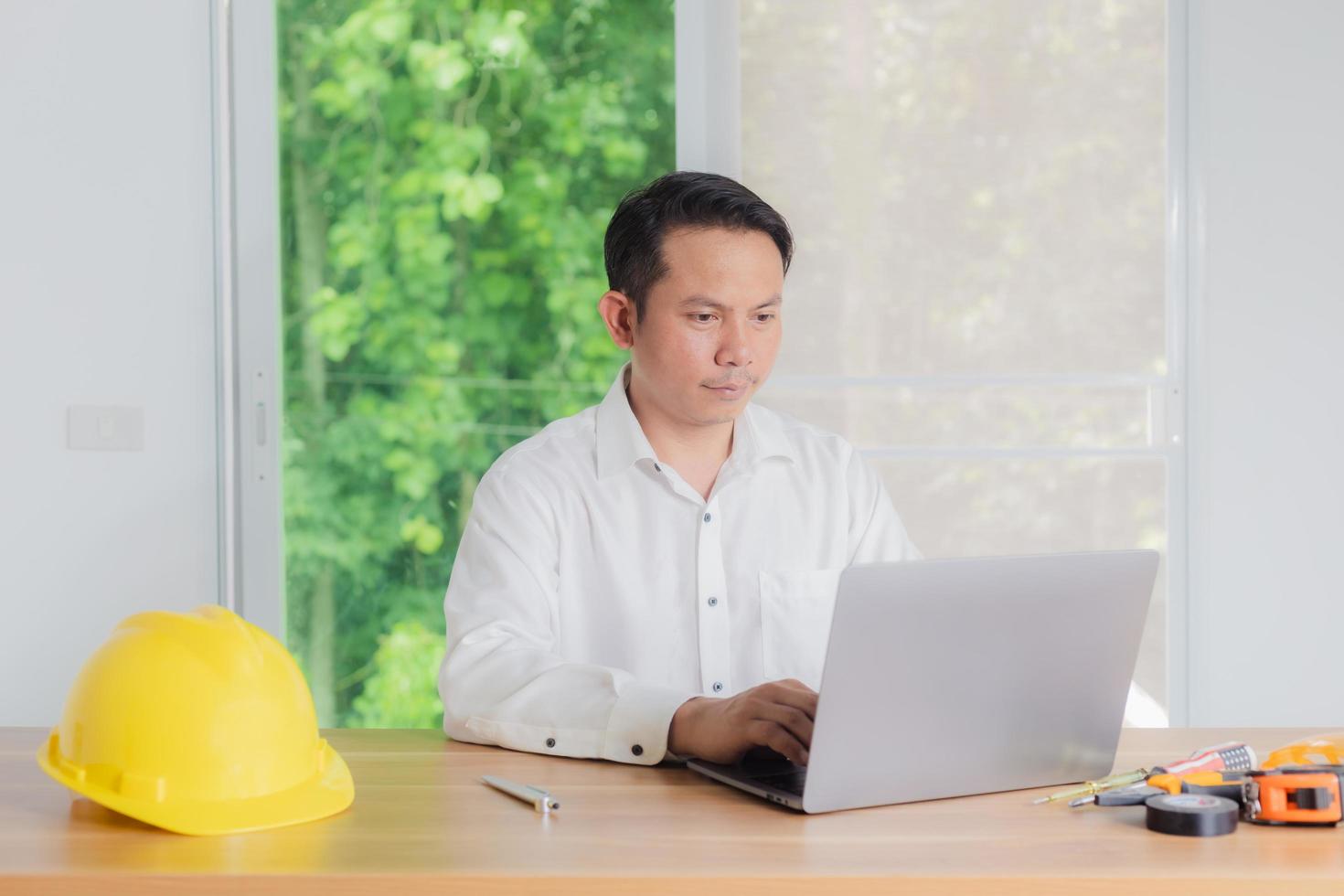 male engineer working in office photo