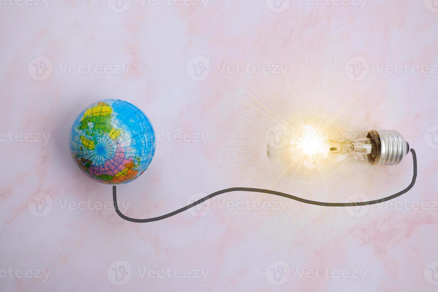 energy saving light bulb on table and business growth concept, new ideas innovation, brainstorming photo