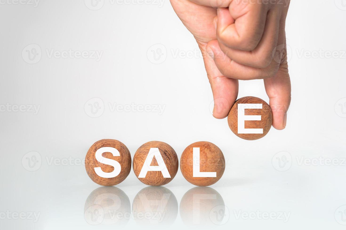 Wooden ball with word  SALE  concept photo