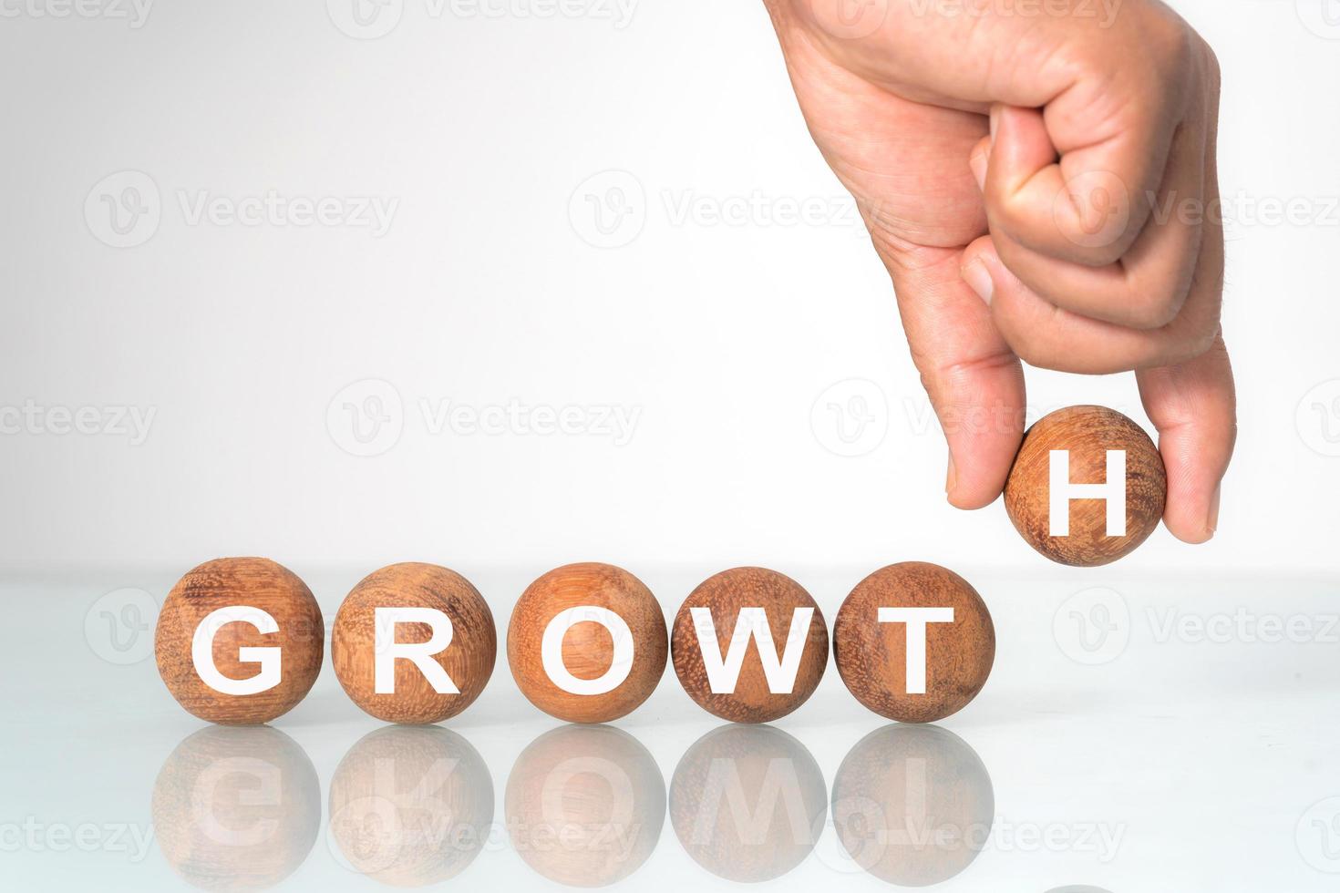 Wooden ball with word  GROWTH  concept photo