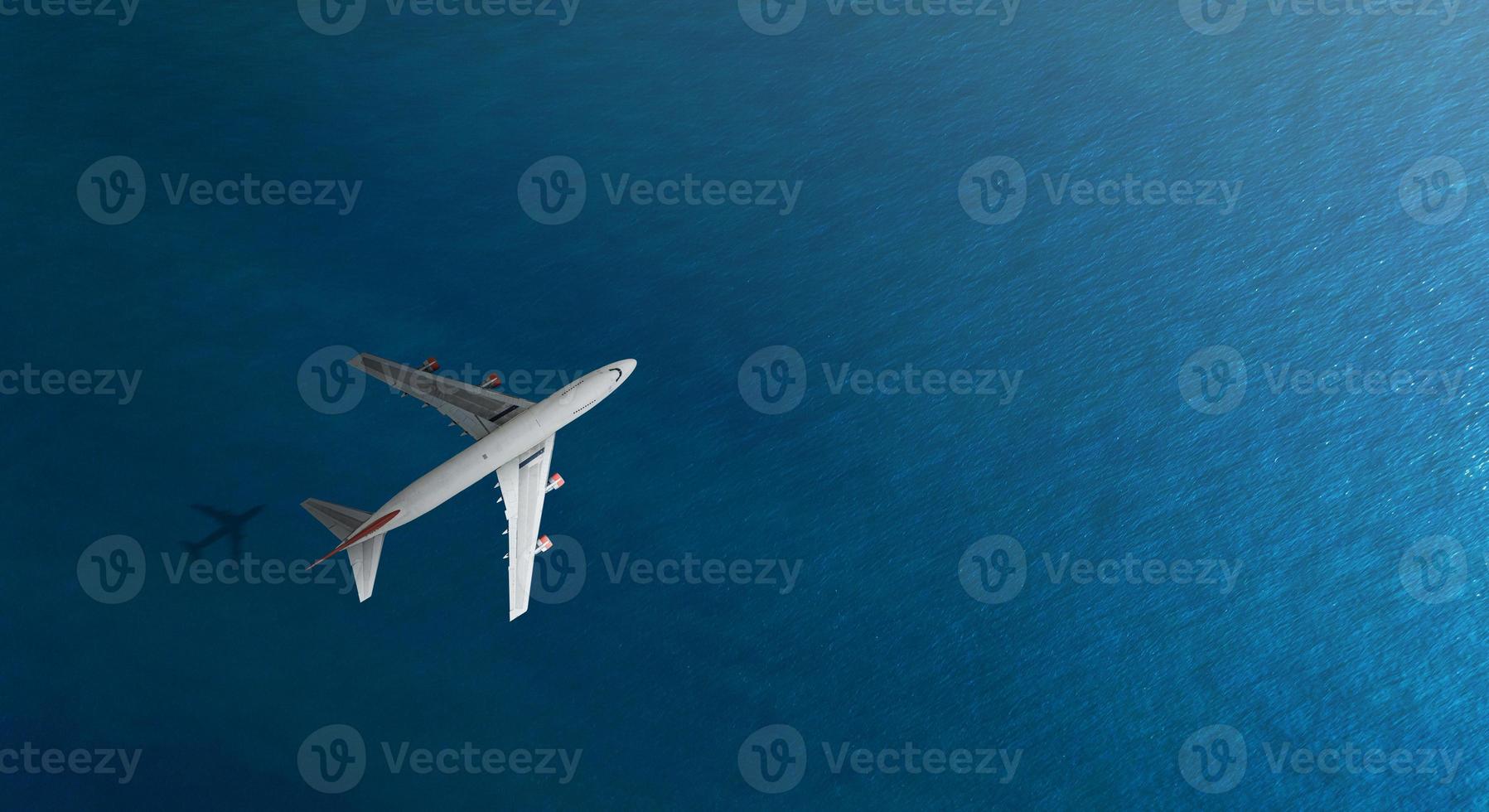 Aerial top view of Airplane flies over a sea, view from above photo