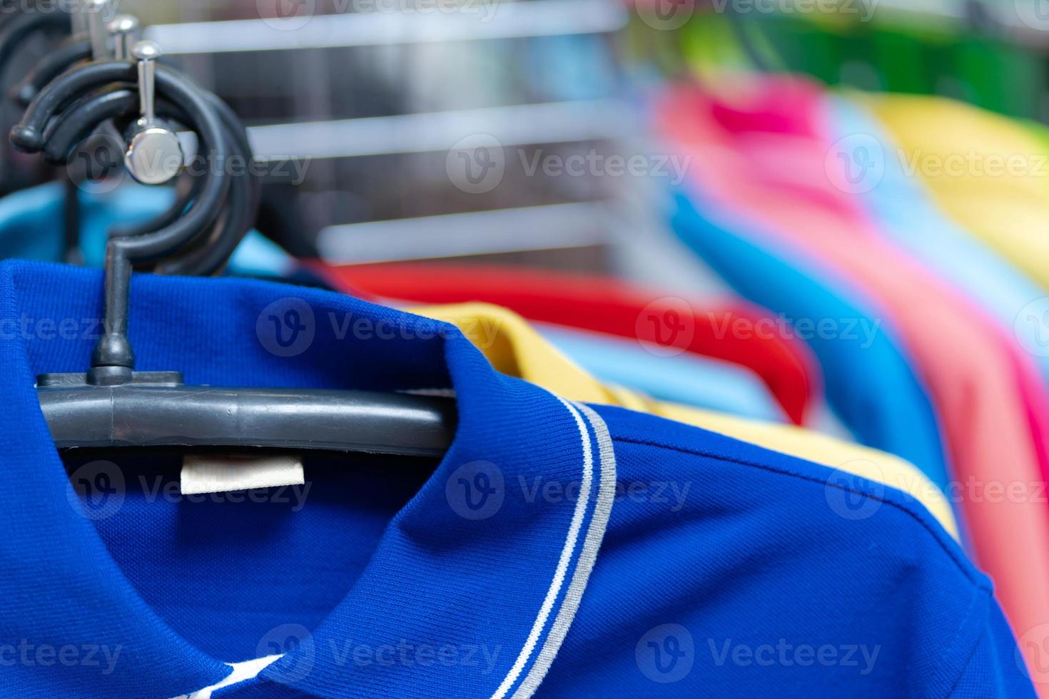 Close up of Colorful polo shirt on hangers photo
