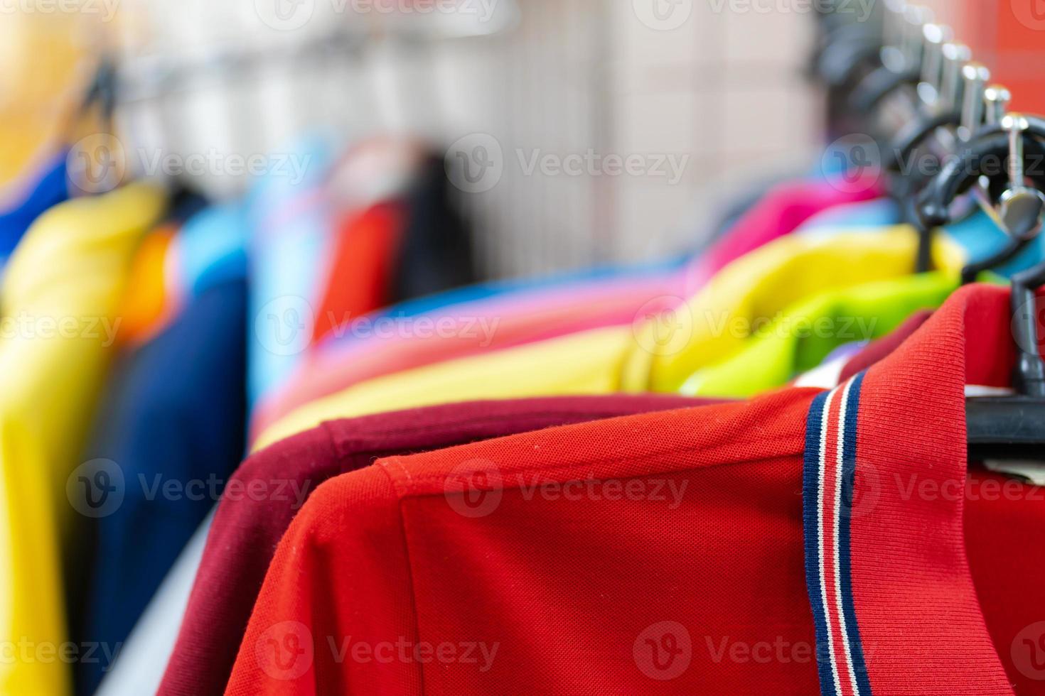 Close up of Colorful polo shirt on hangers photo