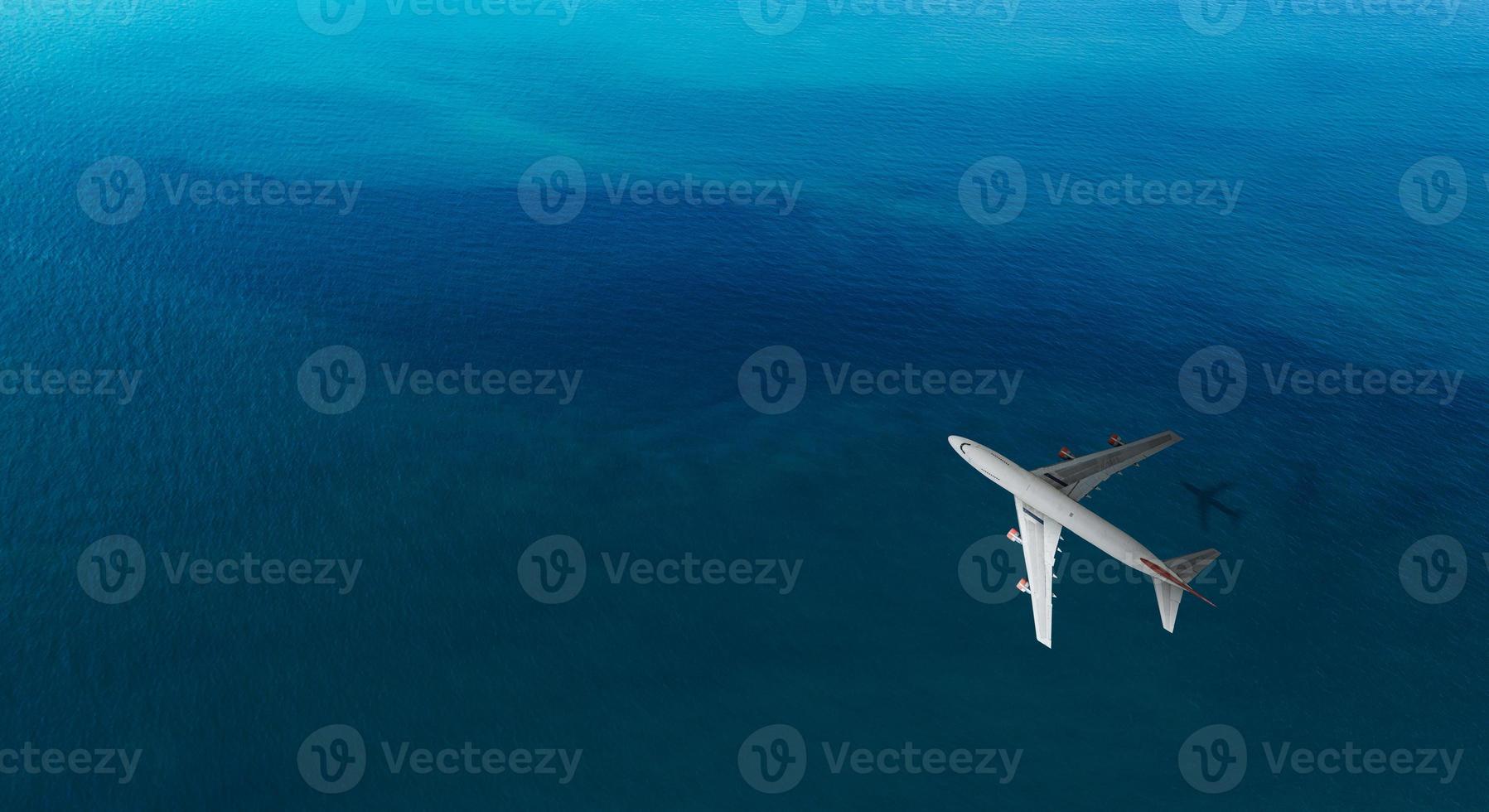 Aerial top view of Airplane flies over a sea, view from above photo