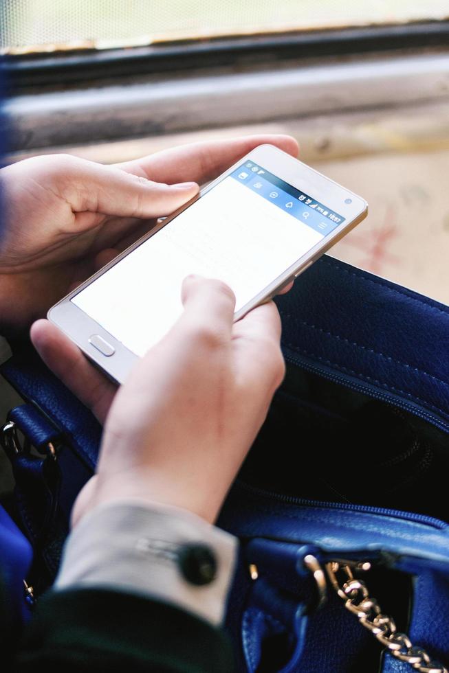 Woman using her smartphone photo