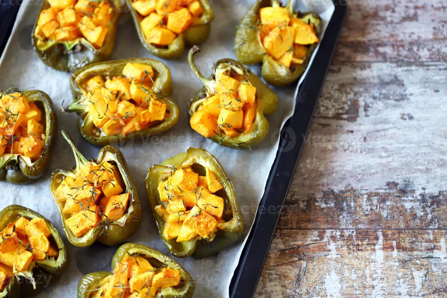 Baked peppers stuffed with pumpkin photo