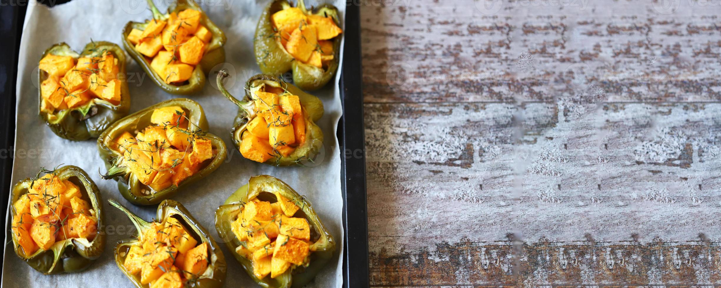 Baked peppers stuffed with pumpkin photo