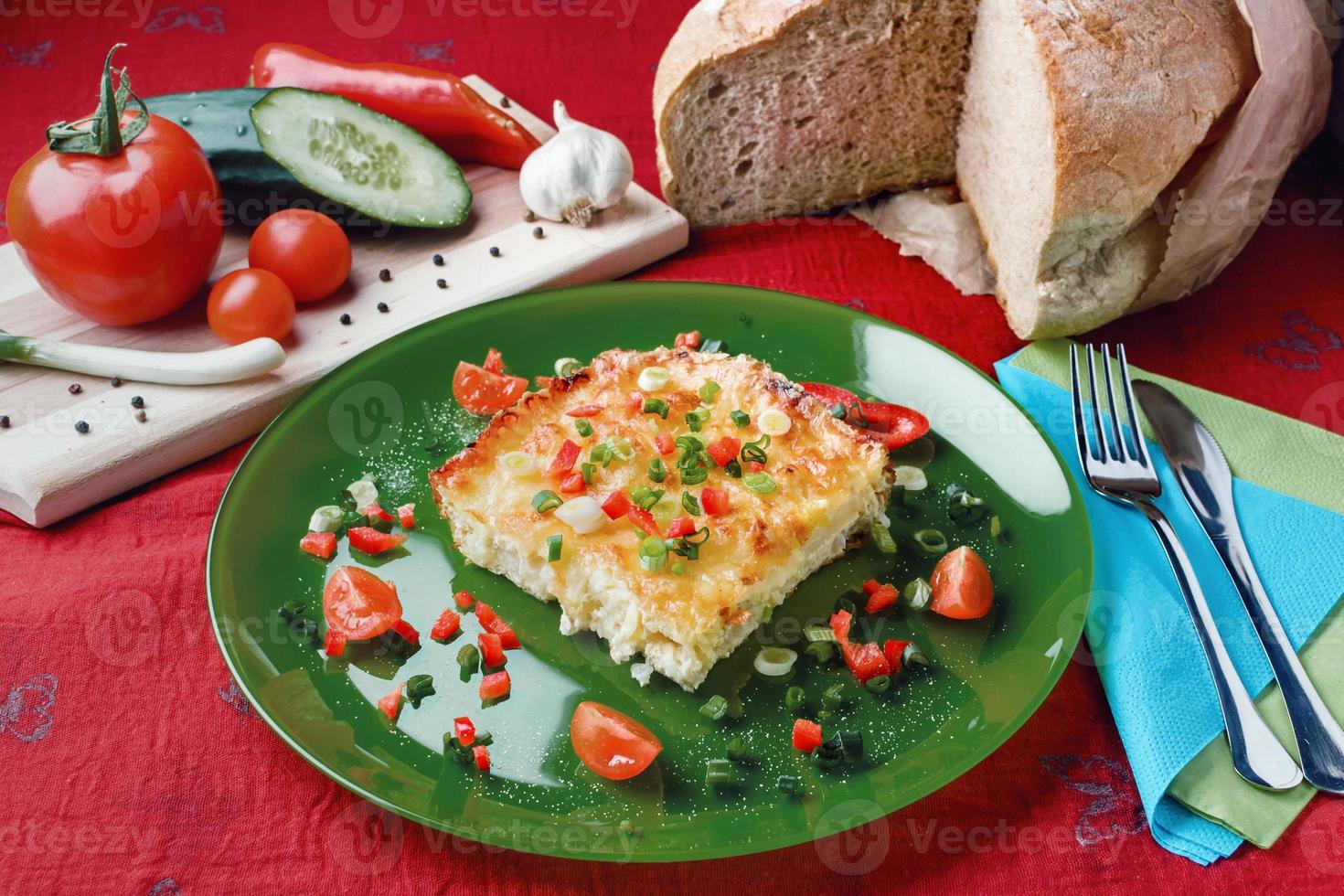 Cauliflower with cheese and vegetables baked in the oven photo