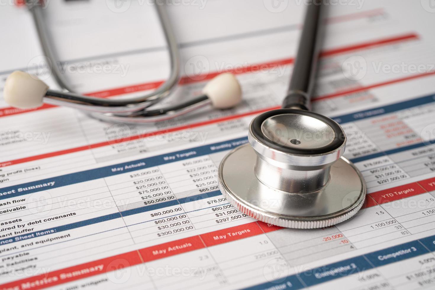 Stethoscope on spreadsheet paper, Finance, Account, Statistics, Investment, Analytic research data economy spreadsheet and Business company concept. photo