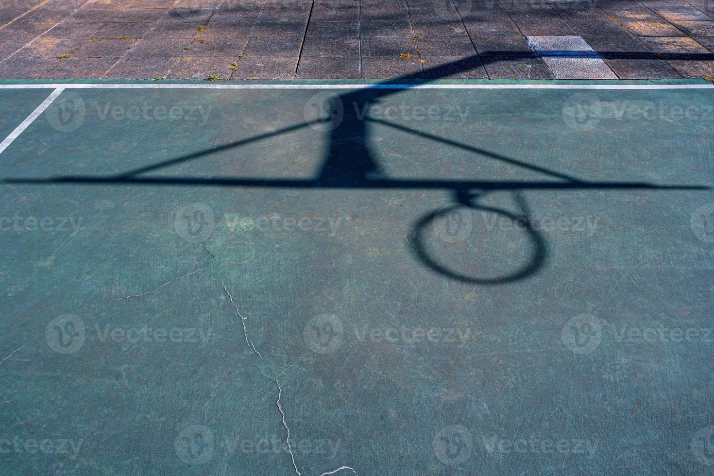 street basketball hoop shadows on the court photo