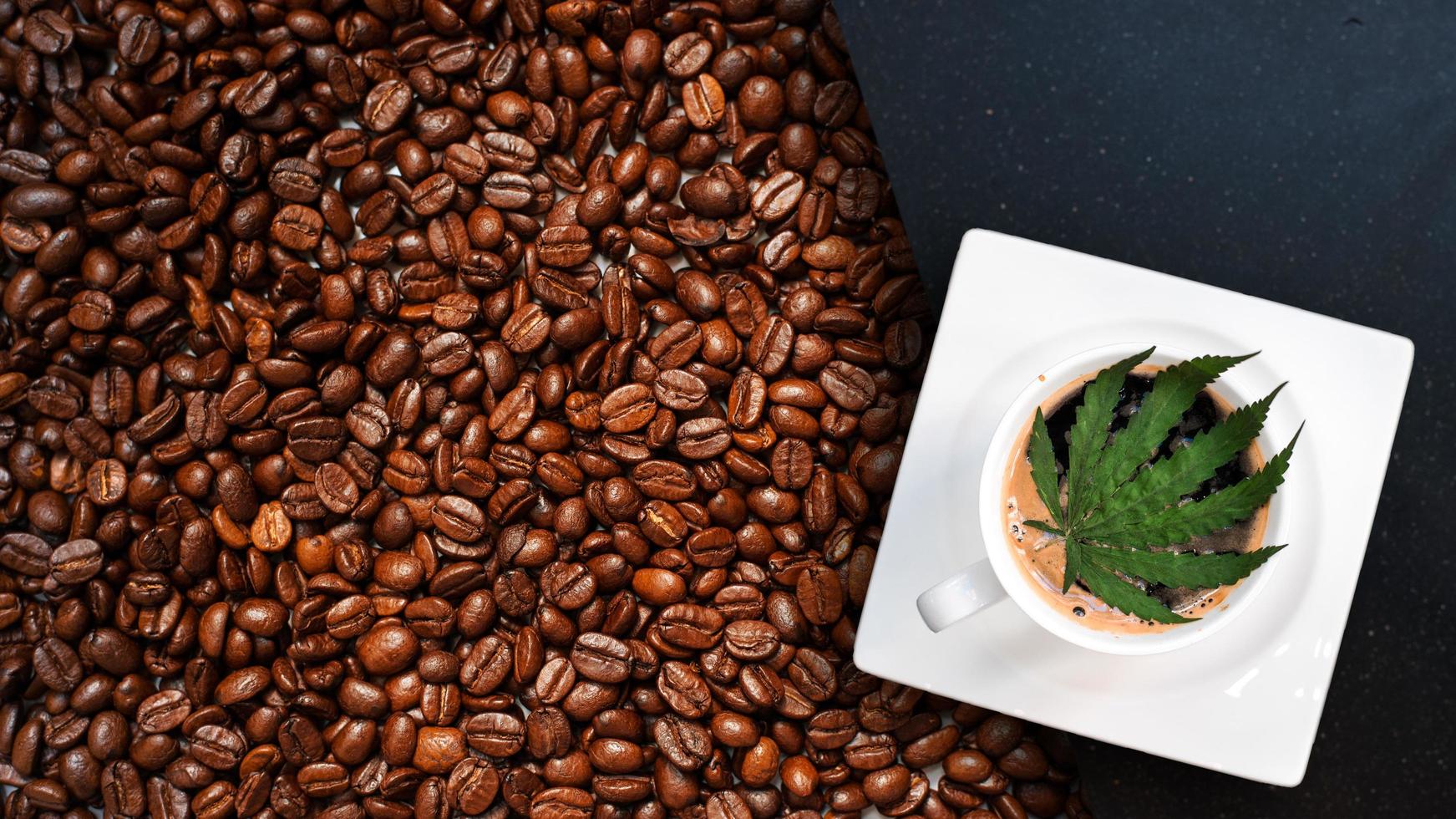 Cannabis coffee with coffee beans on table on the table photo