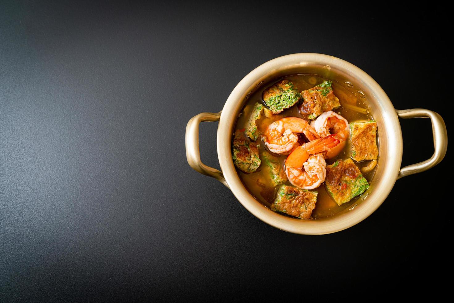 Sour soup made of Tamarind Paste with Shrimps and Vegetable Omelet photo