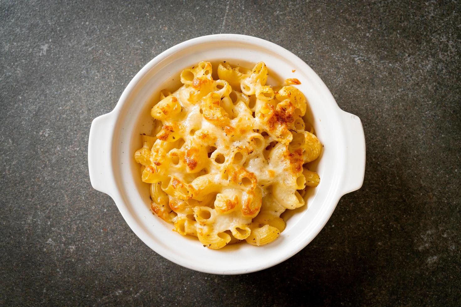 American mac and cheese, macaroni pasta in cheesy sauce photo