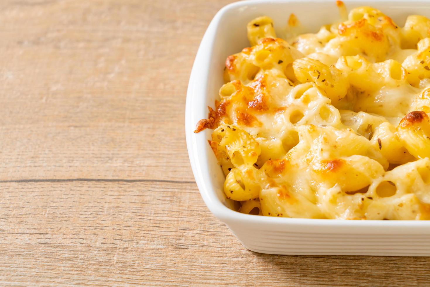 American mac and cheese, macaroni pasta in cheesy sauce photo