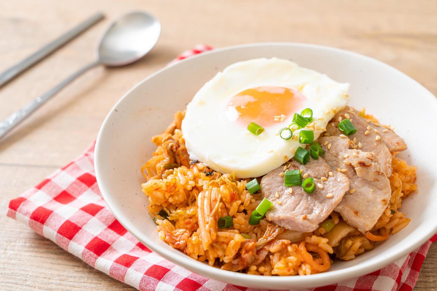 Kimchi fried rice with fried egg and pork photo