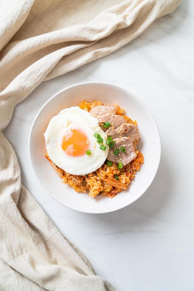 Kimchi fried rice with fried egg and pork photo