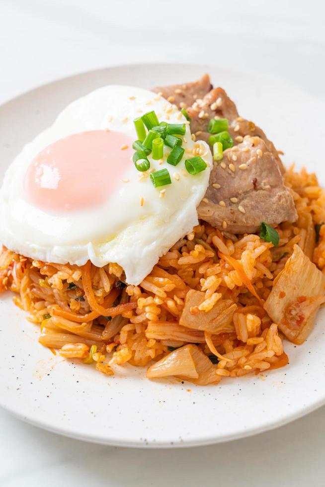 Kimchi fried rice with fried egg and pork photo