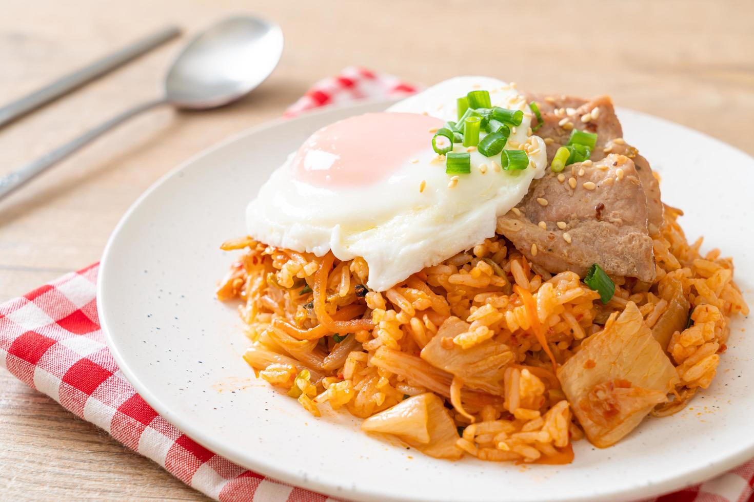 Kimchi fried rice with fried egg and pork photo