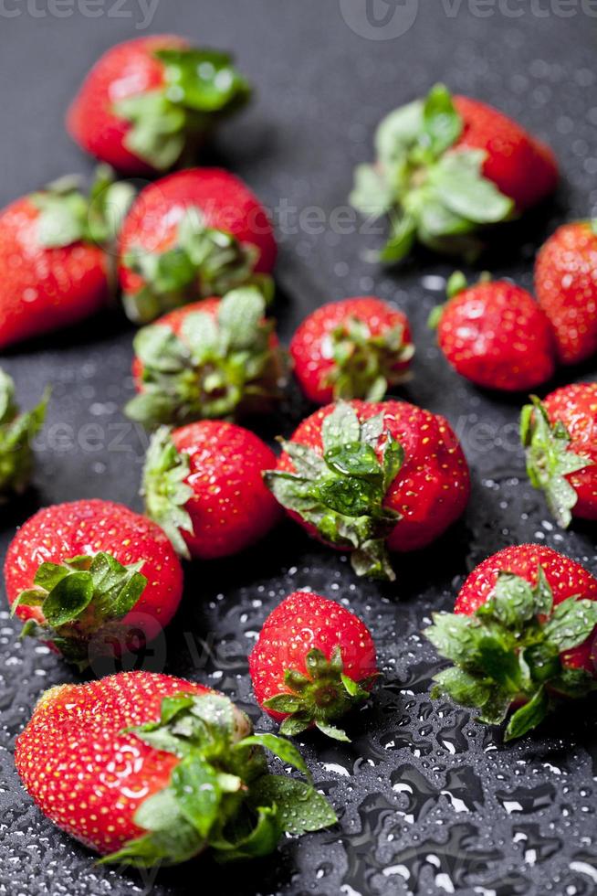 Fresh ripe strawberry with water drops closeup. photo