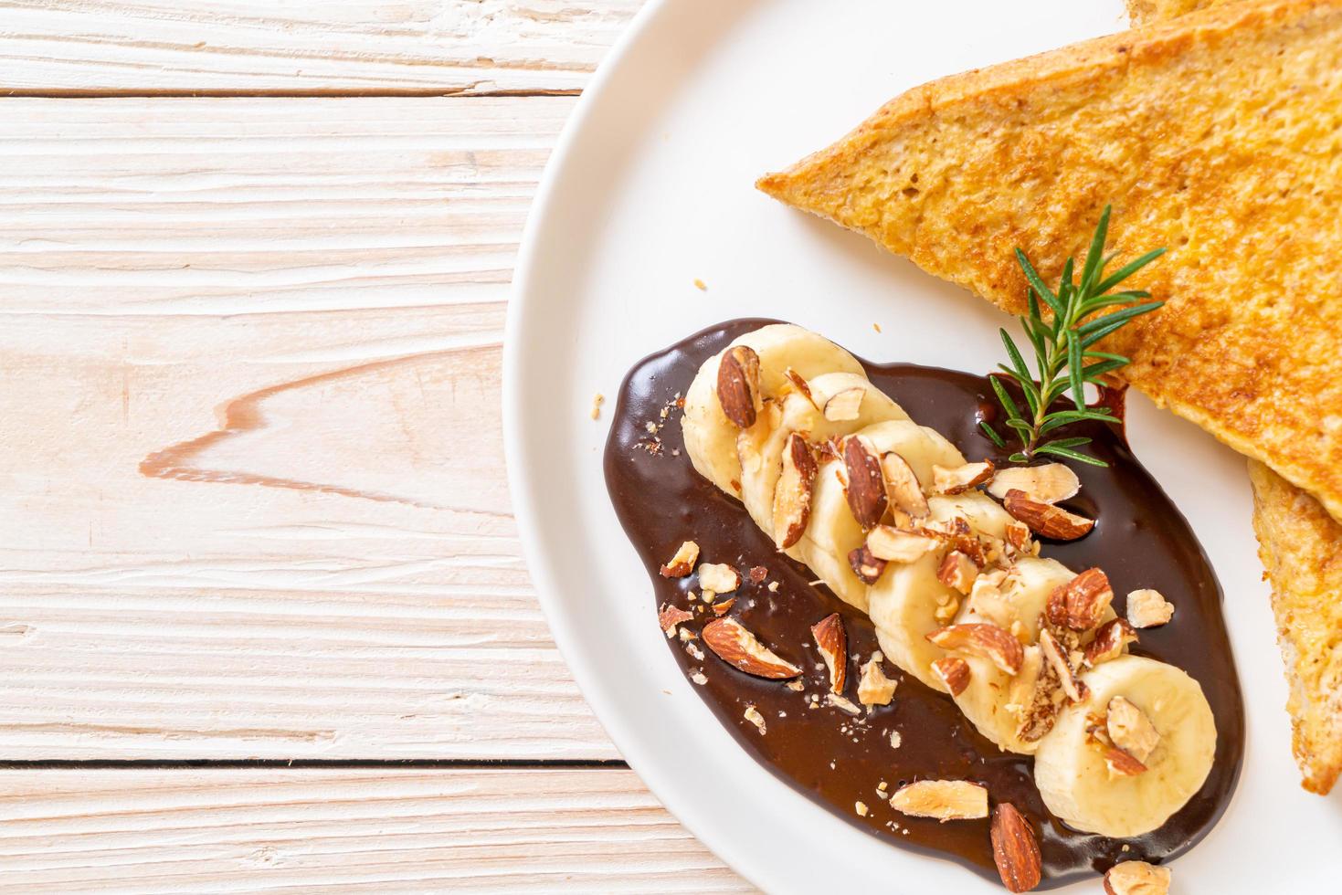 French toast with banana chocolate almonds photo