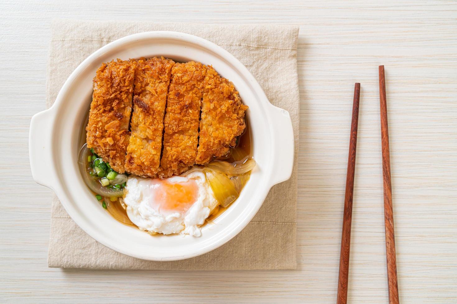 Japanese fried pork cutlet with onion soup and egg photo