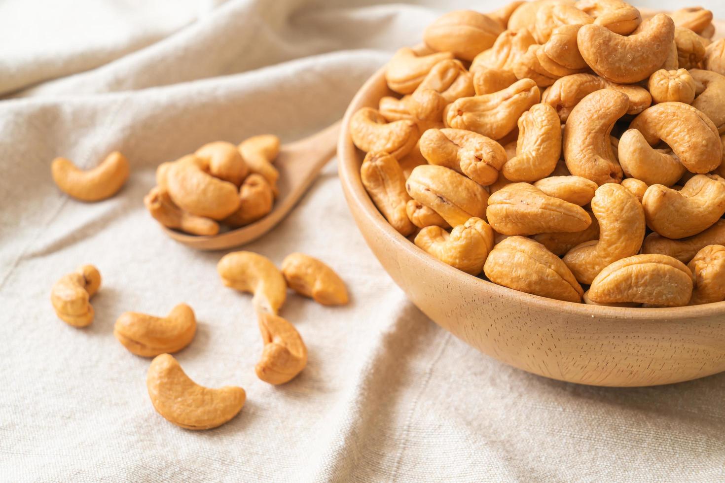 Cashew nuts in wooden bowl photo