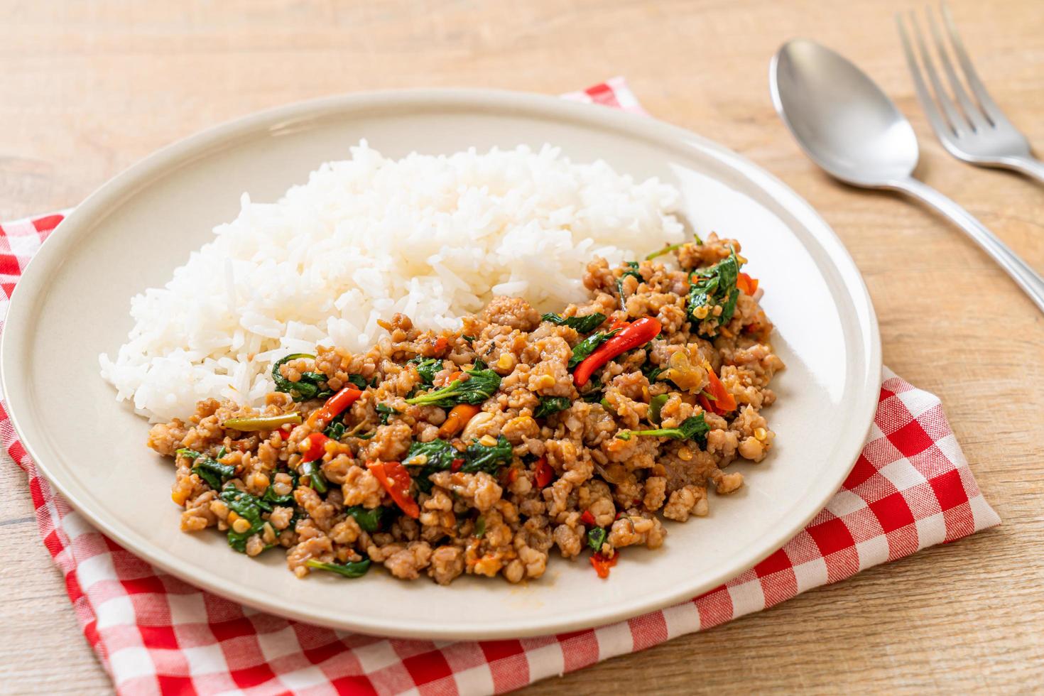 Stir fried Thai basil with minced pork on topped rice photo