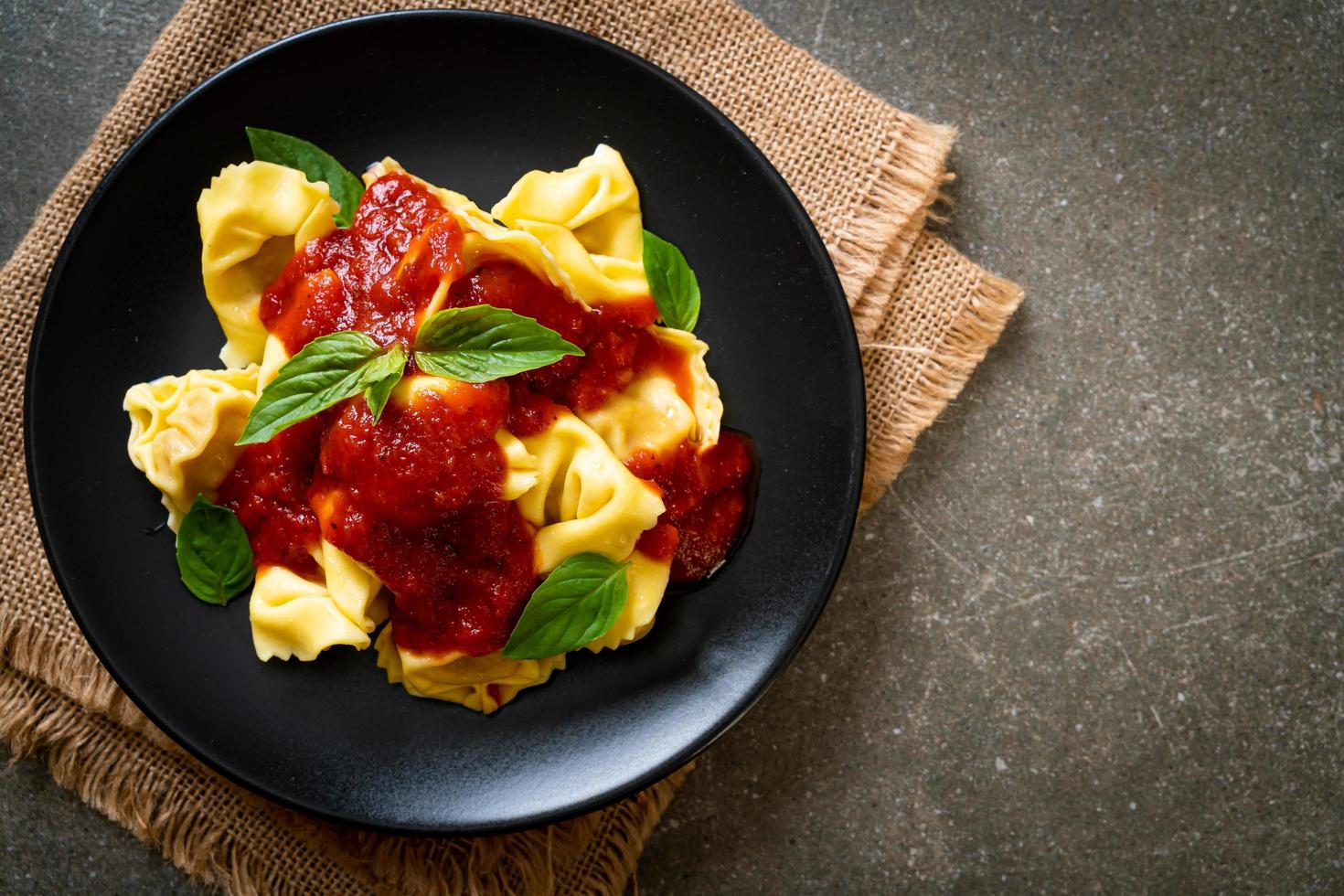 Italian tortellini pasta with tomato sauce photo