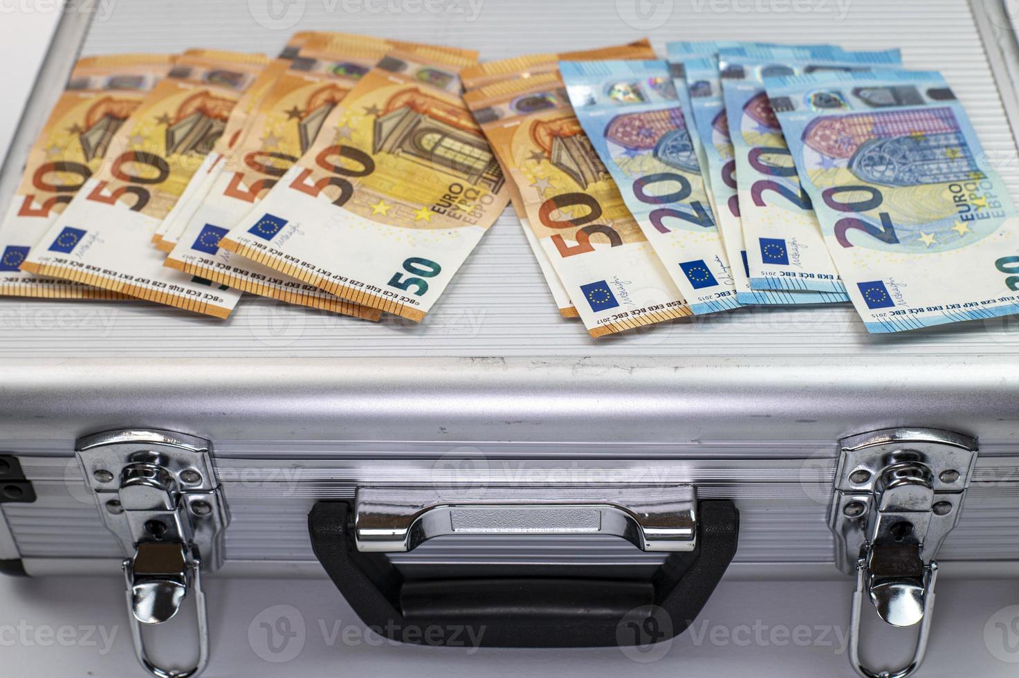 50 and 20 euro banknotes on aluminum case photo